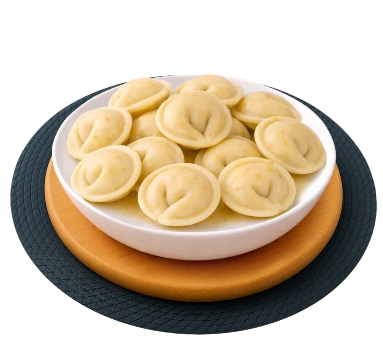 Пельмені з філе курки (тісто з морквою)